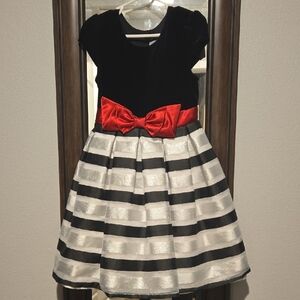 Black and White Striped Dress with Red Bow